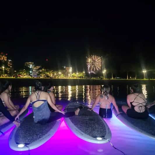 Honolulu: Fireworks Glow and Flow Yoga Class - Floating Yoga on LED SUP Boards in Honolulu